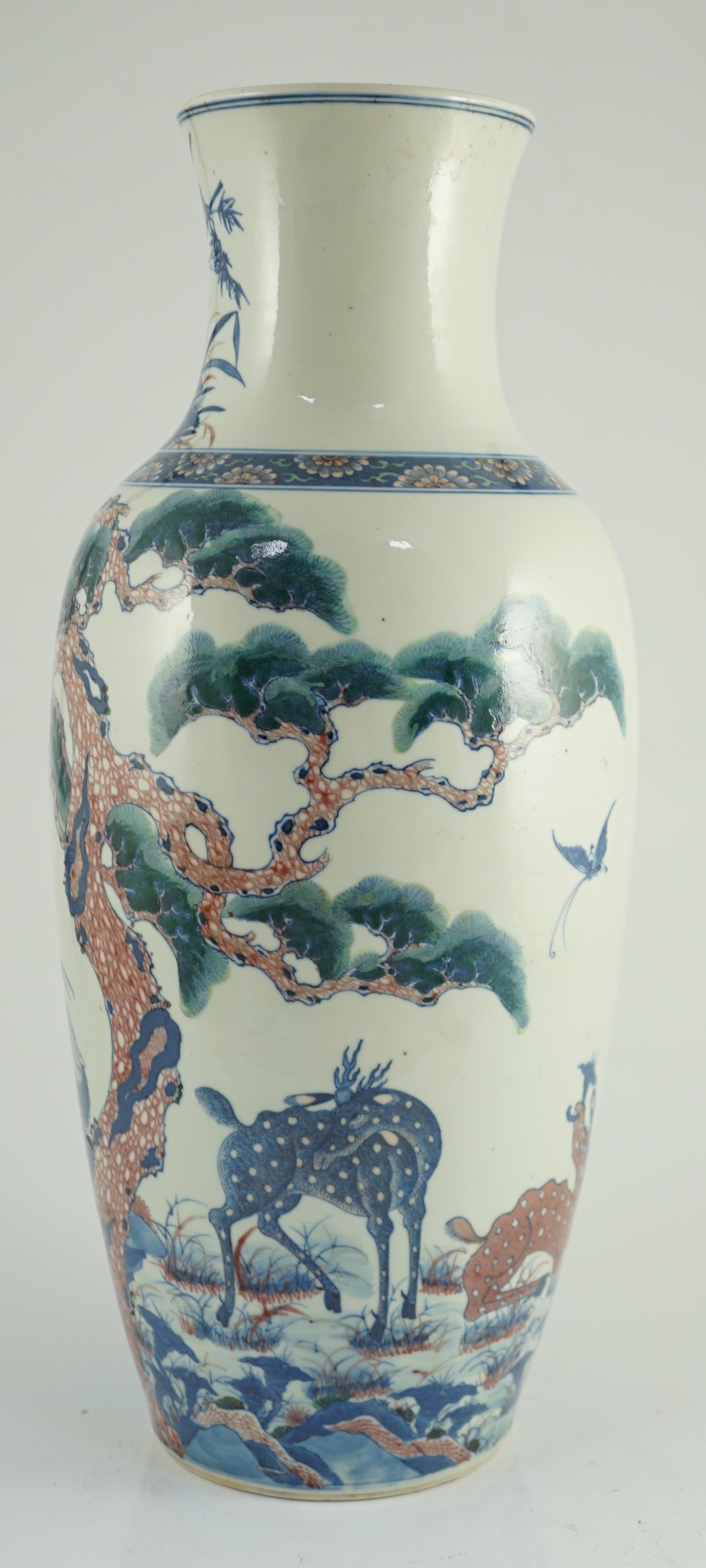 An unusual Chinese green enamelled underglaze blue and copper red tall vase, 19th century, 46.4cm high